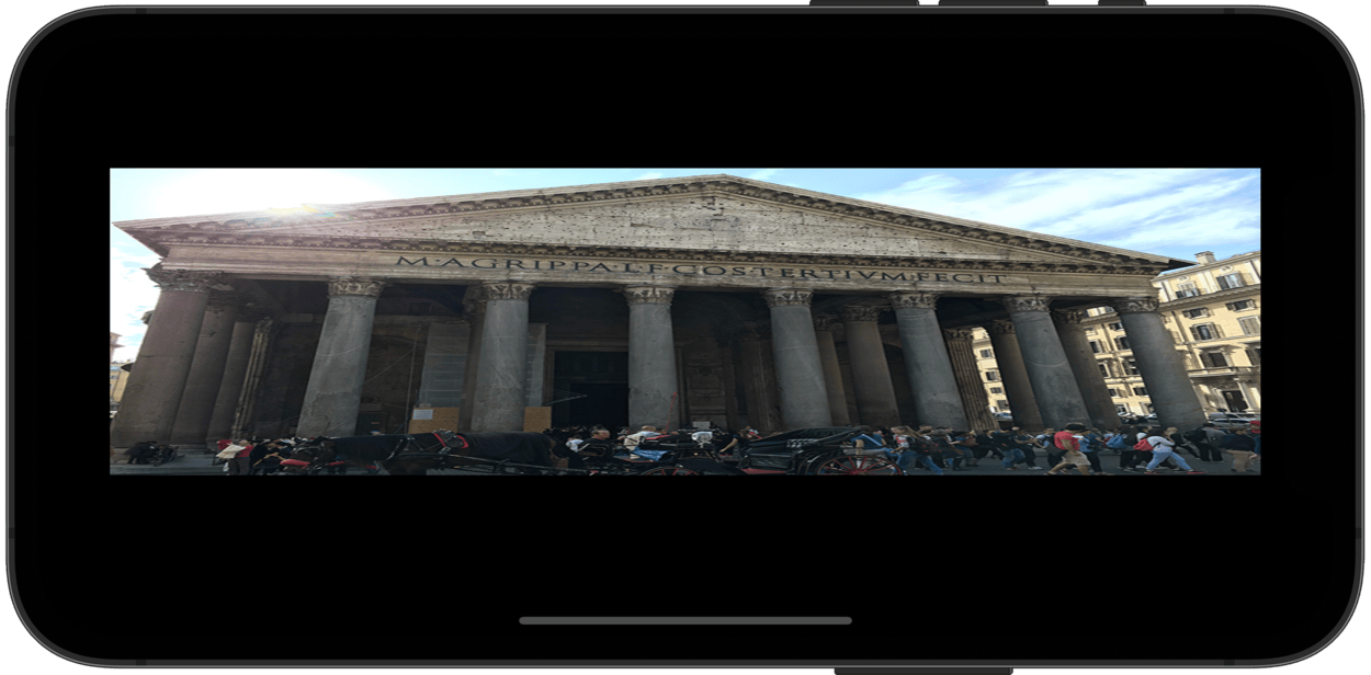A phone showing an image of the Pantheon in Rome. The image is stretched horizontally.