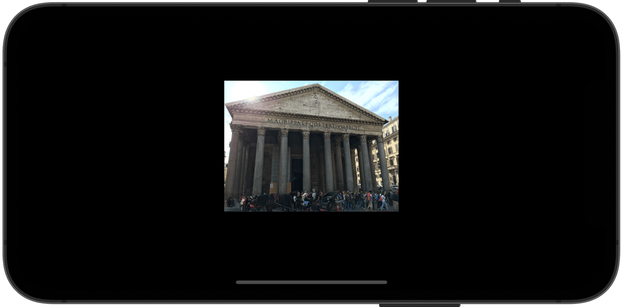 A phone showing an image of the Pantheon in Rome. The image is no longer stretched.